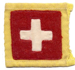 Immagine di Schweizerkreuz aus Filz auf gelbem Stoff